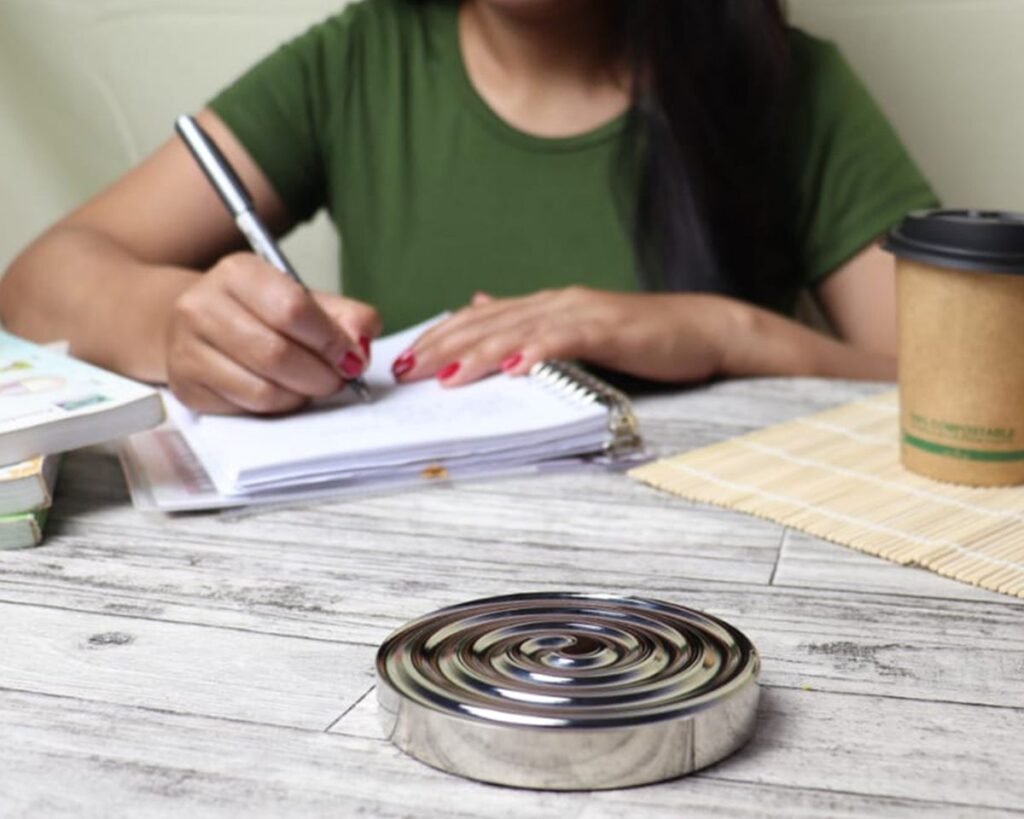 Woman writing in a notebook to start a diary