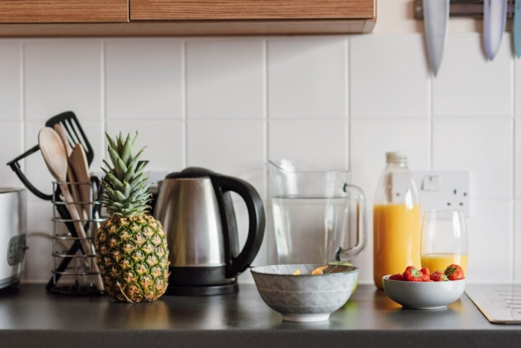 Kitchen table with healthy fruits for food journaling