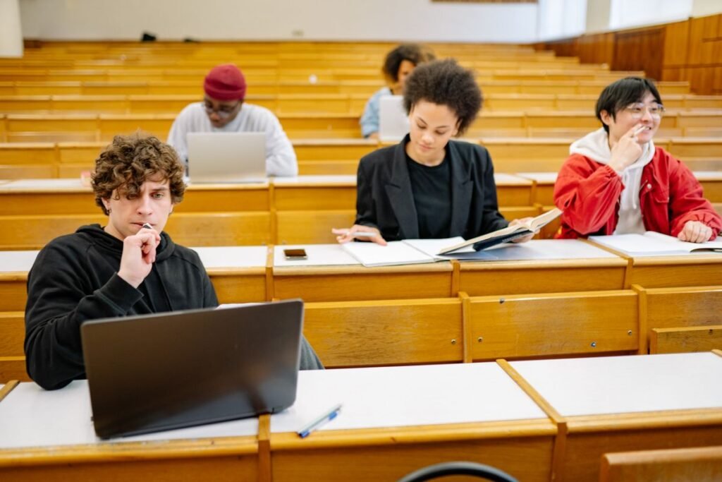 College students studying together in a classroom