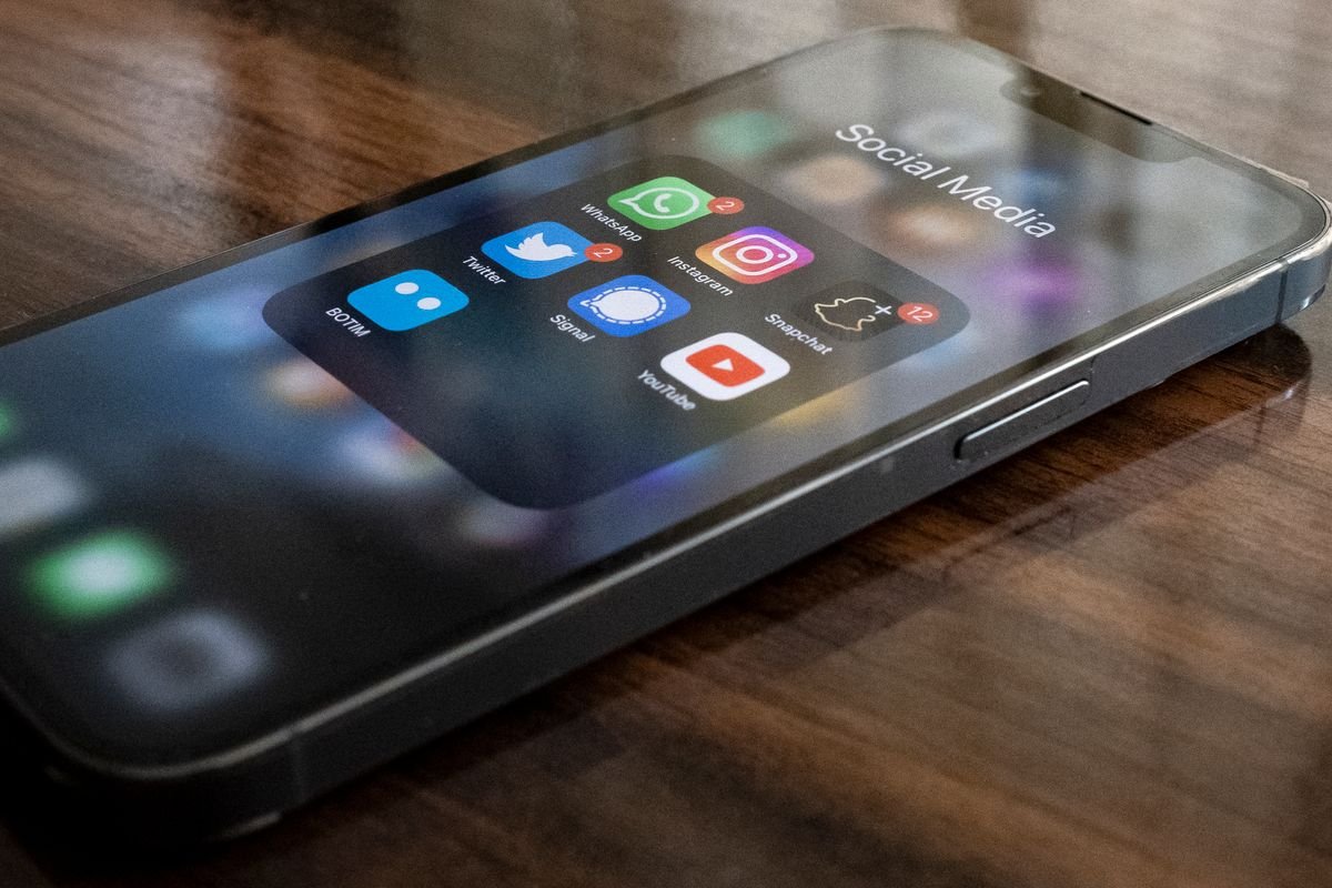 Social media apps displayed on a smartphone screen, representing account privacy controls