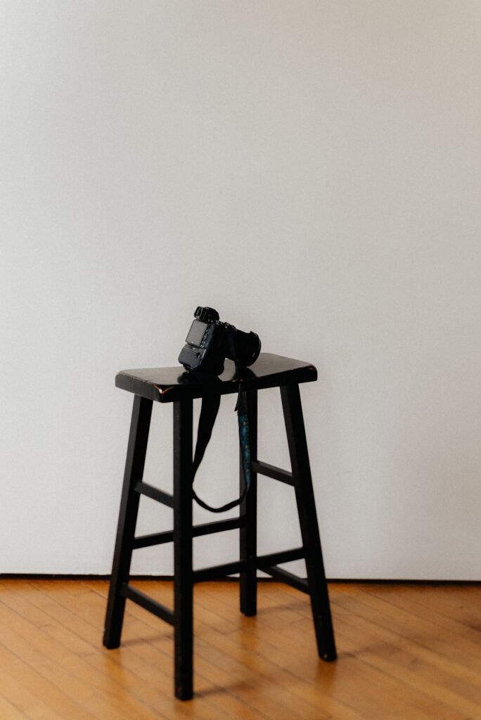 Professional camera on a stool in a minimal studio setup