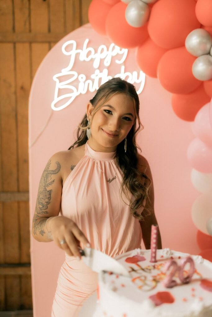 Birthday celebration with cake and balloons indoors