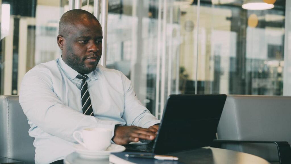 Professional businessman working on a laptop at a cafe