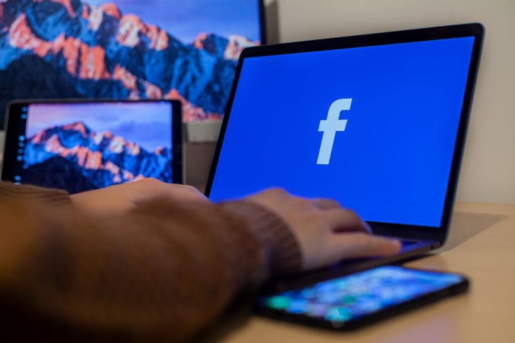 Person using a laptop to customize an online profile