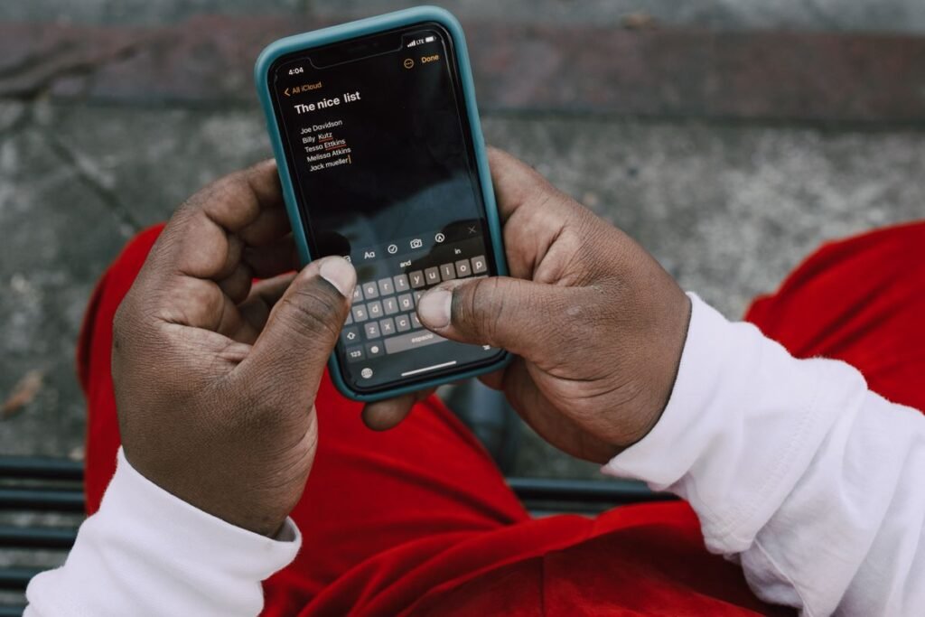 Person typing a list on their phone
