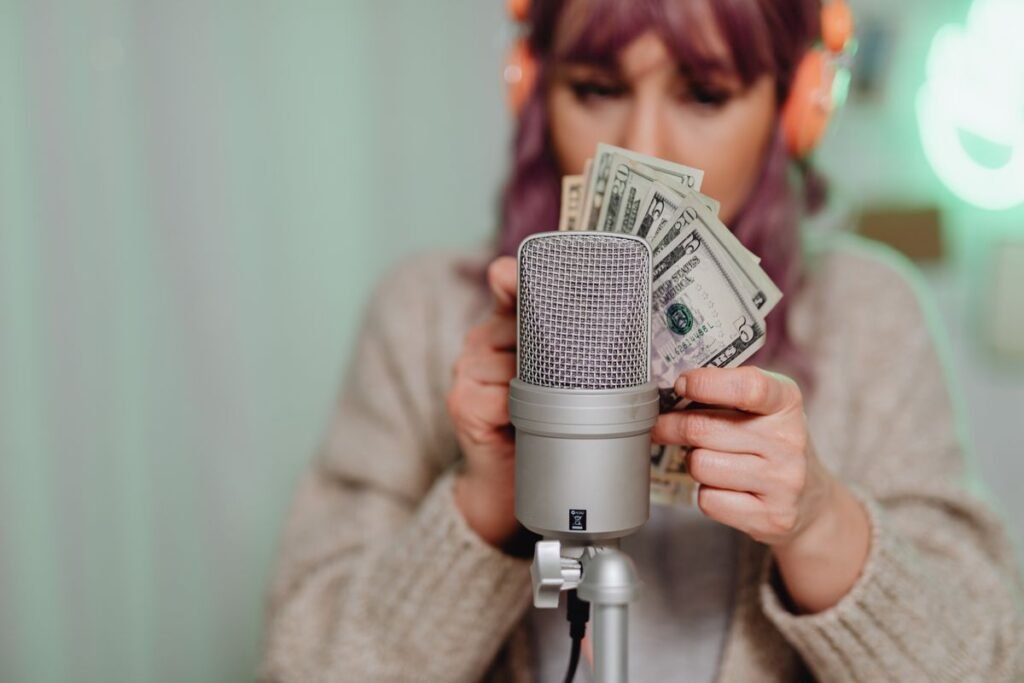 Woman holding a dollar bill, earnings concept