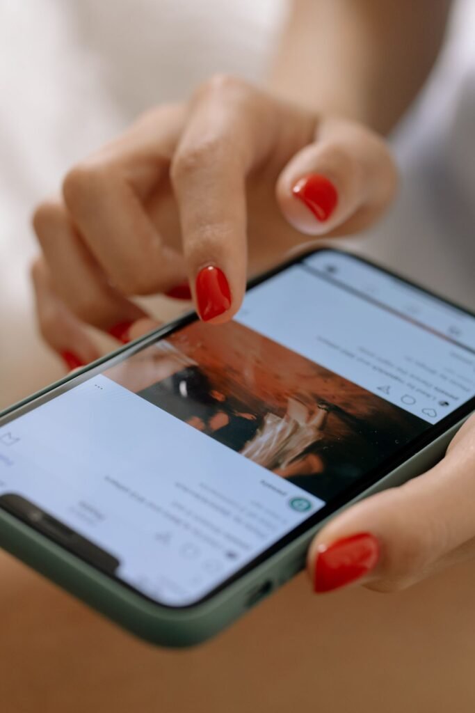 Woman scrolling a social media feed on her phone