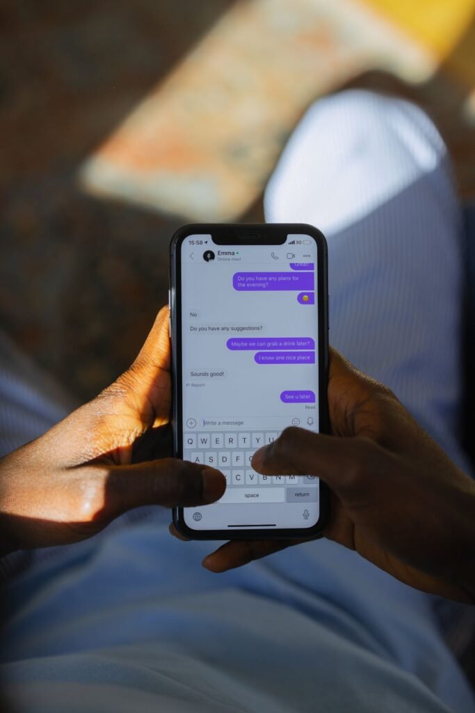 Person using a smartphone for messaging