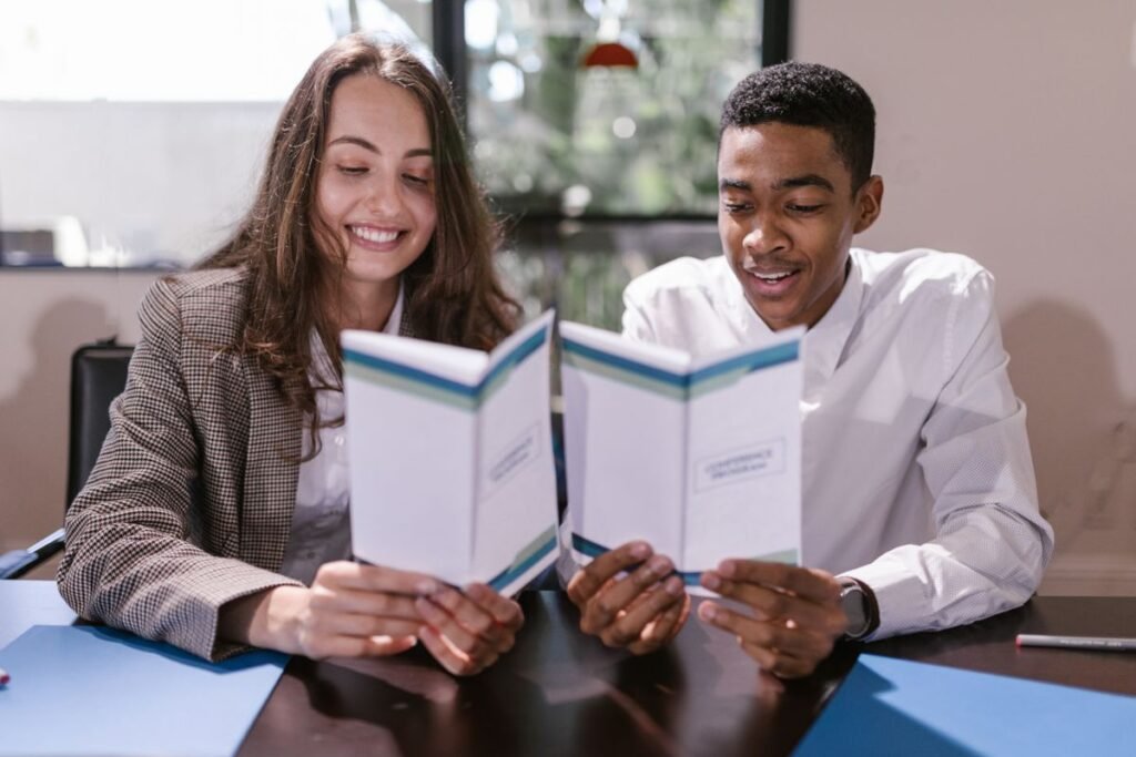 Business professionals reviewing compliance documents together in an office