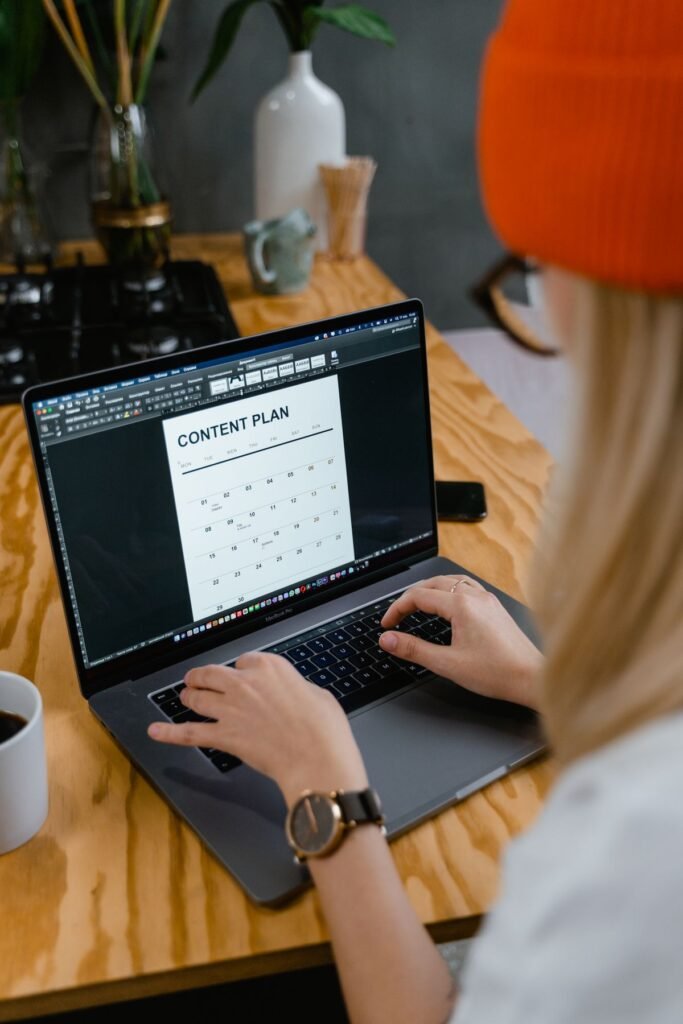 Woman making a content plan using a laptop