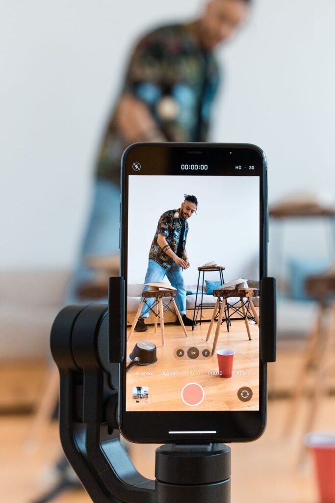 Man recording a vertical video of himself on his phone