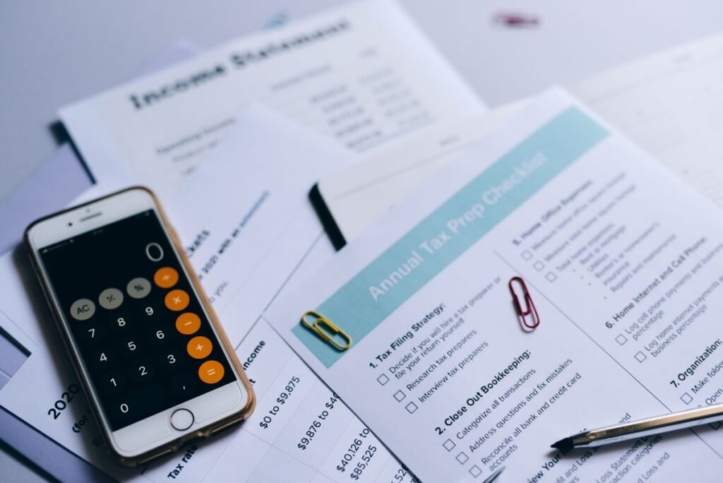Smartphone calculator on accounting documents representing audit management